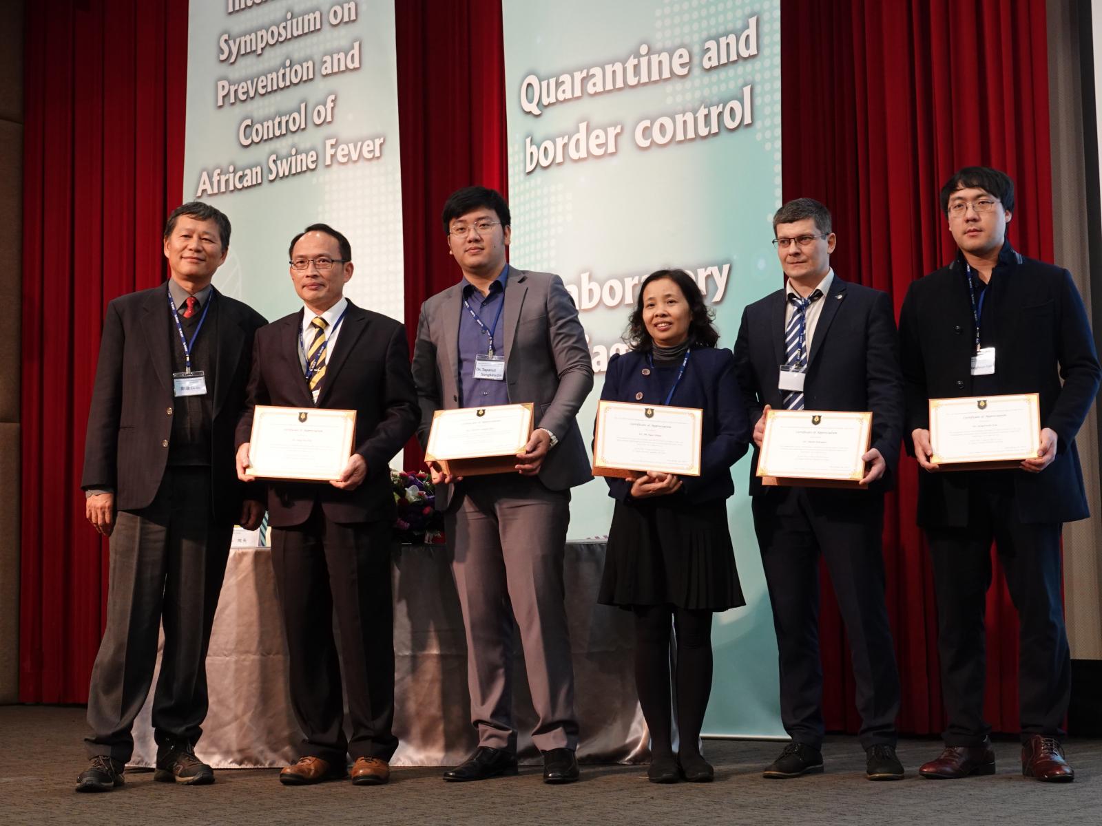  2019 International Symposium on Prevention and Control of African Swine Fever group photo. 